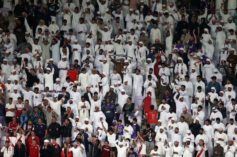 Fans of Al Ain celebrate. EPA