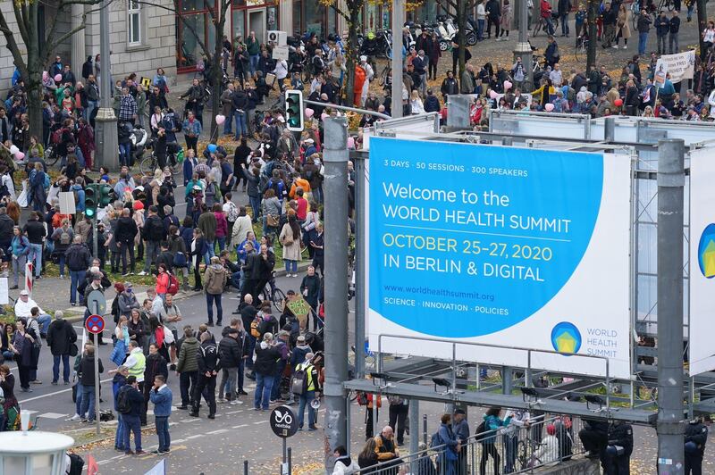 Protesters gather outside the Kosmos events venue. The World Health Summit was originally scheduled with in-person events but was relegated to online only as a precaution against infection. Getty Images