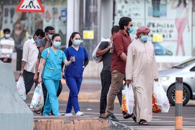 Abu Dhabi, United Arab Emirates, October 5, 2020.  Residents on their way home after a day's work at central Abu Dhabi.
Victor Besa/The National
Section:  NA
For:  Covid-19/standalone