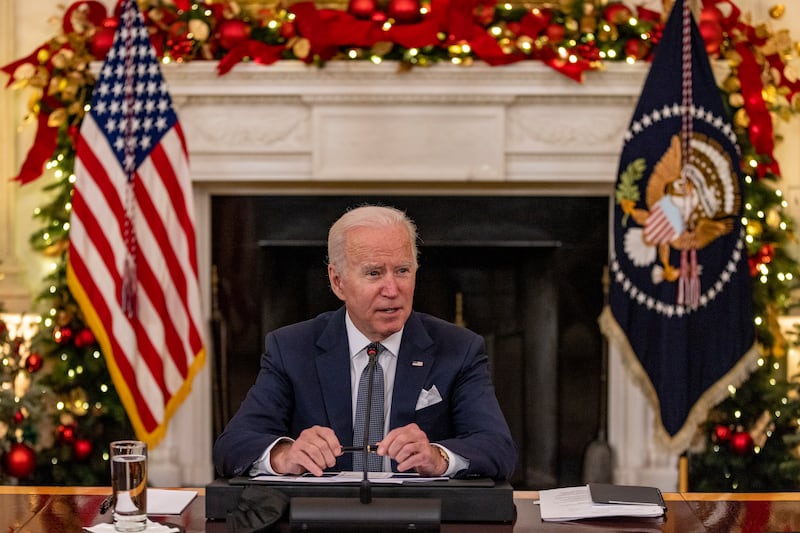 President Joe Biden delivers remarks in the state dinning room at the White House in Washington. The US president and the vice president held a meeting with members of the White House Covid-19 Response Team on the latest developments related to the Omicron variant. EPA