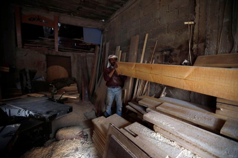 A Yemeni labourer works at a wood shop on International Labour Day in the country's capital, Sanaa. International Labour Day, or May Day, is observed annually on 1 May around the world and celebrates workers, their rights, achievements and contributions to society. EPA