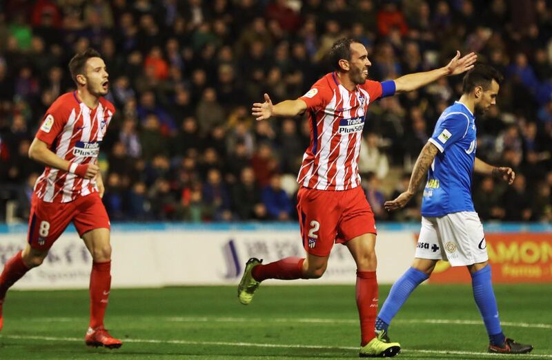 epa06415266 Atletico Madrid's Uruguayan defender Diego Godin (2-R) celebrates after scoring against Lleida during their King's Cup round of 16 first leg match at Camp D'esports stadium in Lleida, northeastern Spain, 03 January 2017.  EPA/Alejandro Garcia