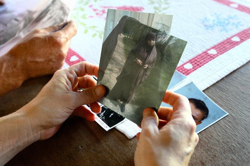 Severine Ali Mehenni holds pictures of her daughter Sahra, at her home in Lezignan Corbieres, France on October 2. Sahra is one of the more than 100 girls from France alone who have left to join Islamist militants in Syria. Fred Scheiber / AP Photo