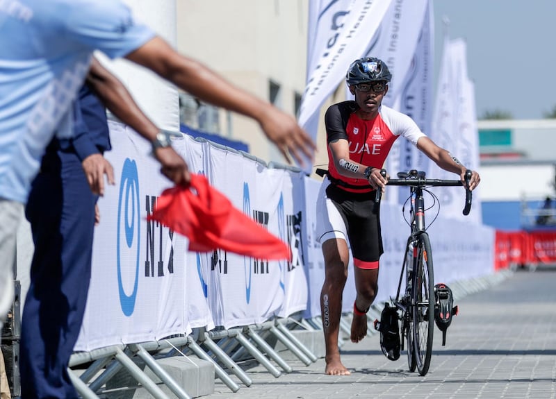 Abu Dhabi, United Arab Emirates, March 8, 2019.  Special Olympics ITU Traiathlon at the YAS Marina Circuit. -Jonah Hambleton finishes the bike stage.
Besa/The National
Section:  NA
Reporter:  Haneen Dajani