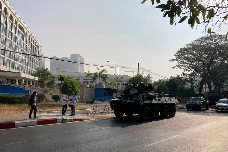 An armored personnel carrier is deployed outside the Central Bank building in Yangon, Myanmar. AP