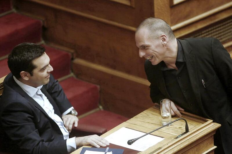 Alexis Tsipras, Greece's prime minister, left, speaks with Yanis Varoufakis, Greece's finance minister, inside the Greek parliament in Athens, Greece, on Sunday, June 28, 2015. Kostas Tsironis / Bloomberg