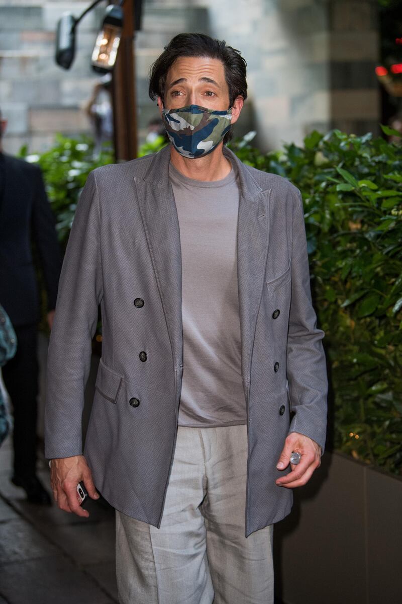 Adrien Brody arrives at the Giorgio Armani fashion show. Getty Images