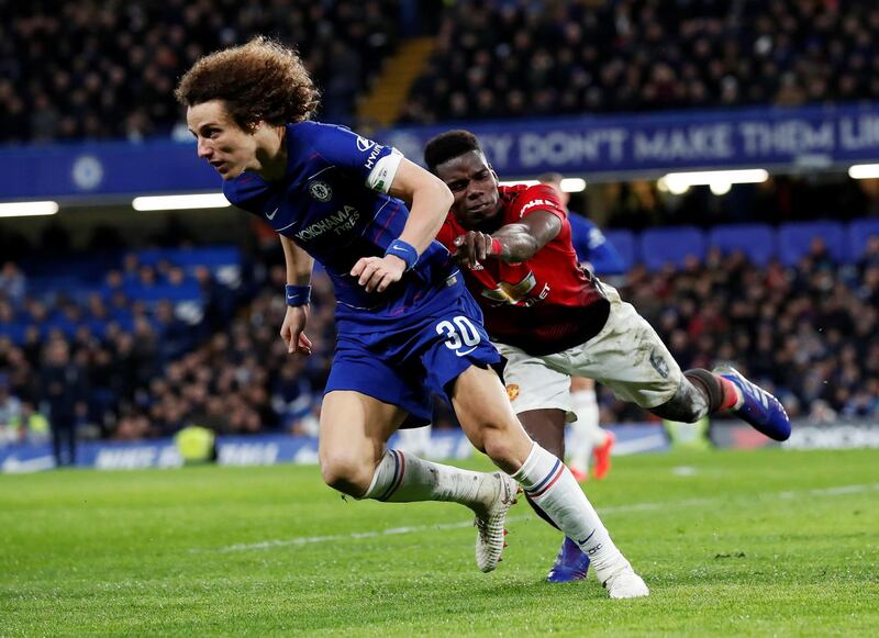 Chelsea's David Luiz in action with Manchester United's Paul Pogba. Reuters