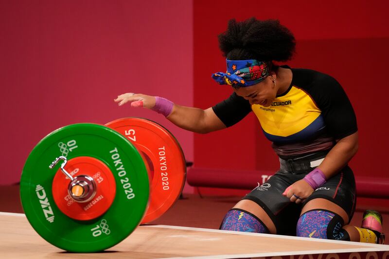 Neisi Patricia Dajomes Barrera of Ecuador celebrates after winning gold in the women's 76kg weightlifting.