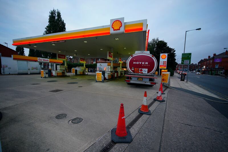 A tanker delivers fuel to a petrol station in Liverpool, England. Photo: PA