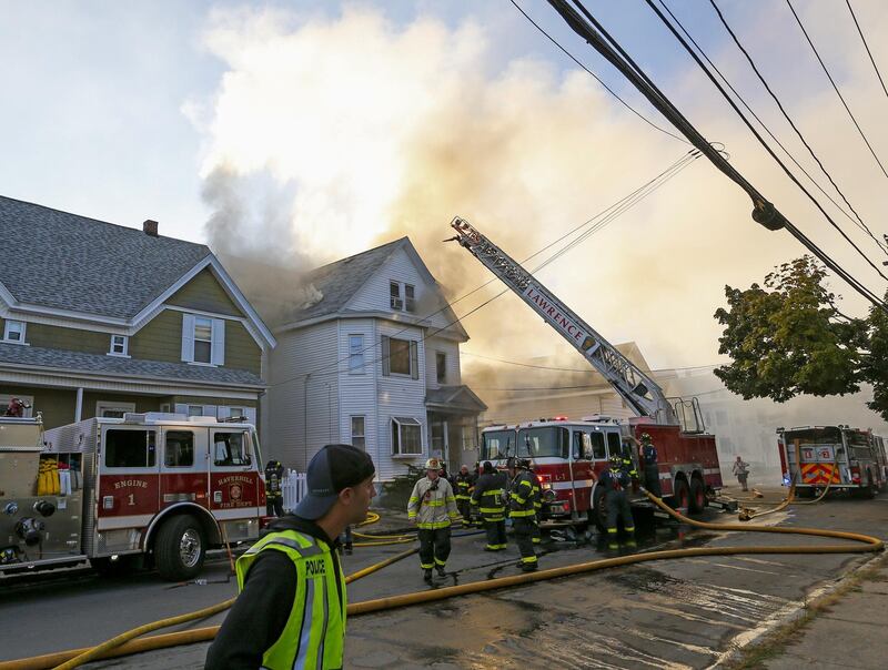 epaselect epa07018414 Firefighters battle a fire in a house in Lawrence, Massachusetts, USA, 13 September 2018. A series of reported gas explosions in towns north of Boston Massachusetts set homes ablaze and forced mandatory evacuation for residents.  EPA/CJ GUNTHER