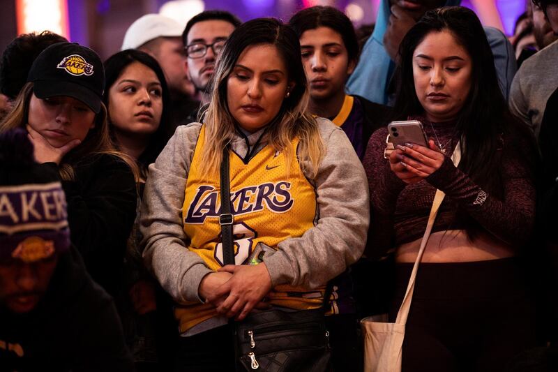 Fans of late Los Angeles Lakers guard Kobe Bryant gather at the LA Live entertainment complex across the street from the Staples Center, home of the Los Angeles Lakers, in Los Angeles, California.  EPA