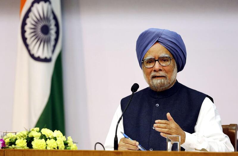 Indian Prime Minister Manmohan Singh announces on Friday that he is ready to hand over the baton to a new generation of leaders. Harish Tyagi / AFP

