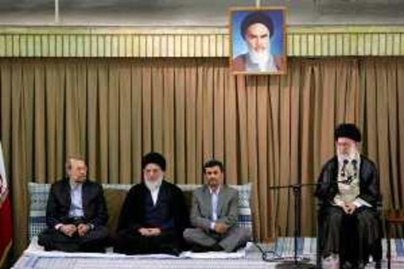 A handout picture posted on the Iranian supreme leader's website shows (L-R) Iran's Parliament Speaker Ali Larijani, judiciary chief Ayatollah Mahmoud Hashemi Shahrudi, President Mahmoud Ahmadinejad and supreme leader Ayatollah Ali Khamenei attending a ceremony in Tehran on July 20, 2009. Khamenei accused the enemies of the Islamic republic of fomenting the crisis over last month's disputed presidential election, state television reported on July 20. Portrait shows Iran's late revolutionary founder Ayatollah Ruhollah Khomeini. AFP PHOTO/HO == RESTRICTED TO EDITORIAL USE == *** Local Caption ***  438666-01-08.jpg