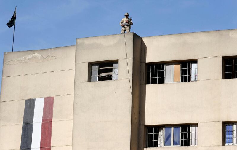 An Egyptian soldier stands guard on a building during the presidential election in Giza near Cairo. Amr Abdallah Dalsh / Reuters