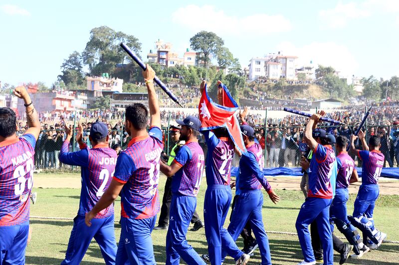 Nepal celebrate their eight-wicket win over UAE.