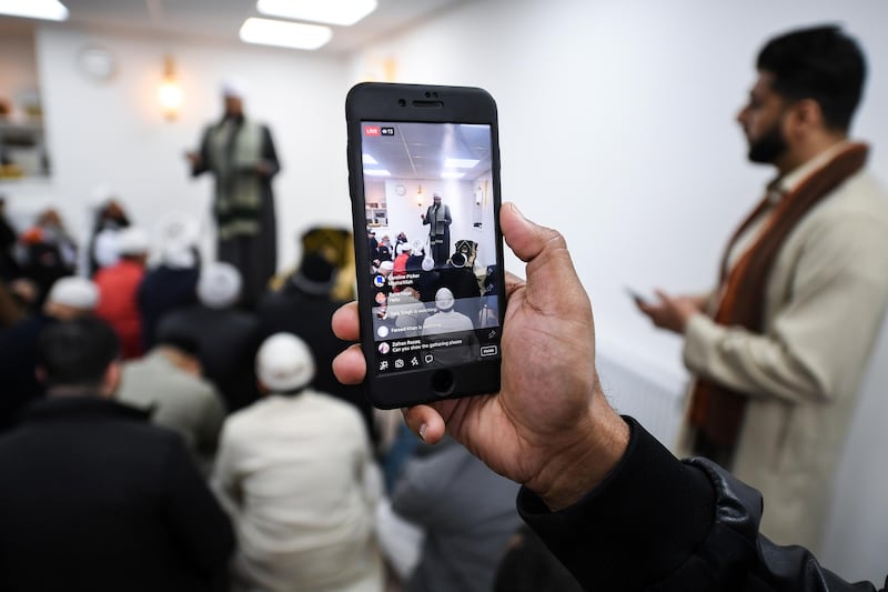 Members of the Muslim community listen to Iman Mufti Abdur-Rahman Mangera as they attend the opening of the first mosque built on the Western Isles, Stornoway, Scotland, on May 11, 2018. Jeff J Mitchell / Getty Images