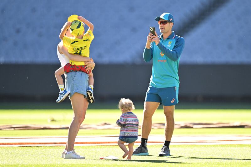 Australia's Alex Carey of Australia takes a photo of his family during training at the Melbourne Cricket Ground on Sunday, December 25, 2022, on the eve of the Boxing Day Test against South Africa. Getty