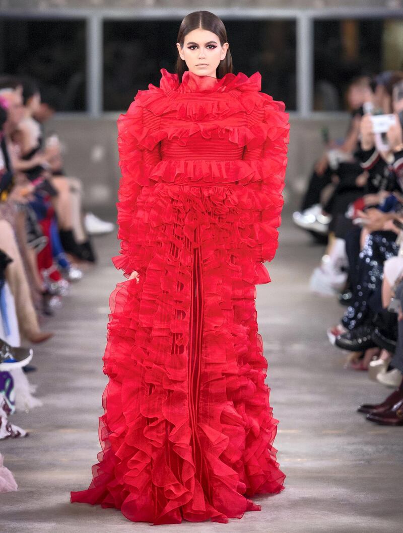 17-year-old Kaia Gerber, daughter of Cindy Crawford, presented the last look of the show -  a fierce red, ruffled gown without any accessories 