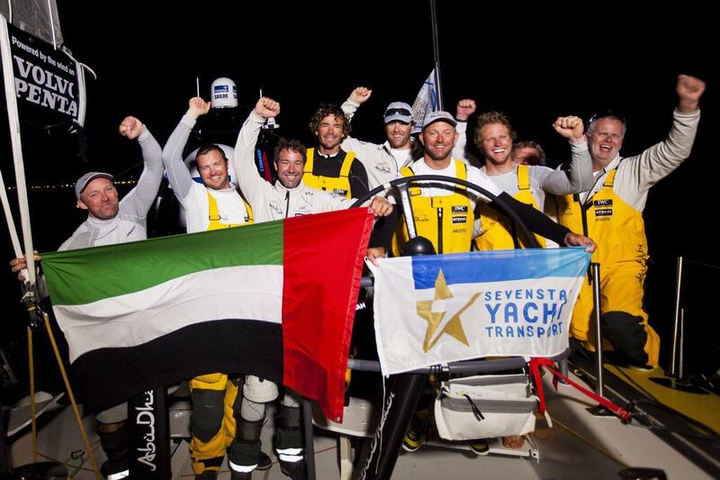 The Abu Dhabi Ocean Racing crew celebrate crossing the finish line to win the Round Britain and Ireland Race on Friday night in a record times. Courtesy Ian Roman

