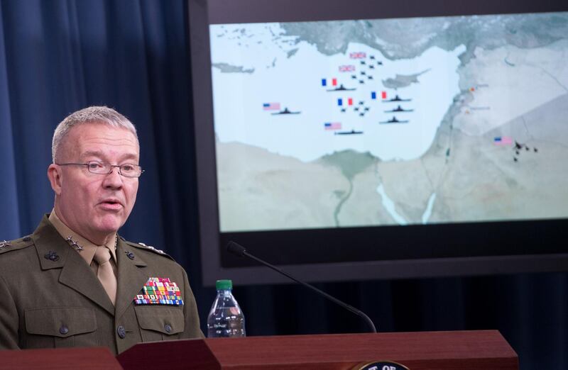 Director, Joint Staff, US Marine Lt. Gen. Kenneth F. McKenzie Jr., briefs the press on the stikes against Syria, at the Pentagon in Washington, DC, on April 14. 2018. 
The Pentagon said Saturday that a joint US-British-French operation against Syria's regime had "successfully hit every target," countering assertions from Russia that dozens of missiles were intercepted. / AFP PHOTO / SAUL LOEB