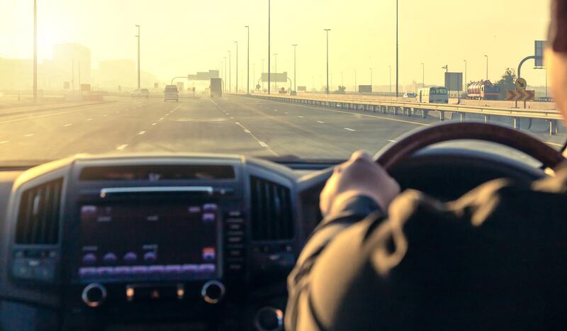 Inside the car, driving on the highway at sunset in Dubai UAE. Getty Images