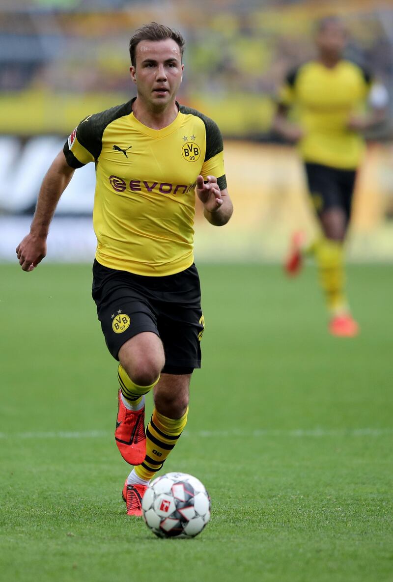 DORTMUND, GERMANY - MARCH 30: Mario Goetze of Dortmund runs with the ball during the Bundesliga match between Borussia Dortmund and VfL Wolfsburg at Signal Iduna Park on March 30, 2019 in Dortmund, Germany. (Photo by Christof Koepsel/Bongarts/Getty Images)