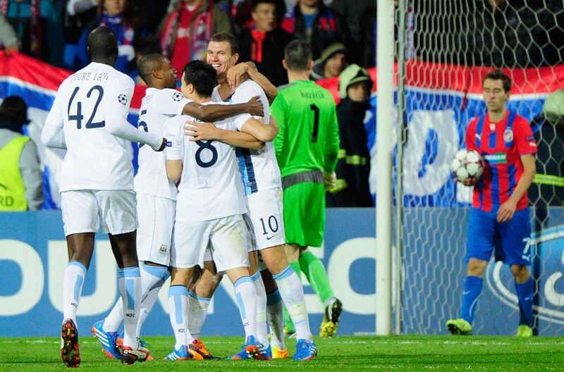 Edin Dzeko, facing camera, broke the deadlock for Manchester City in the second half against Viktoria Plzen. Lennart Preiss / Getty Images