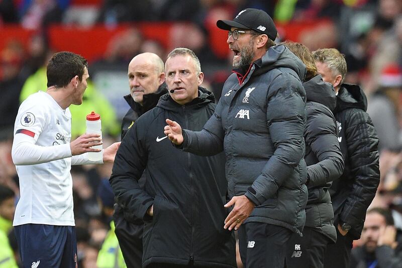Liverpool manager Jurgen Klopp reacts to Sadio Mane's disallowed goal as fourth official Jonathan Moss looks on. AFP