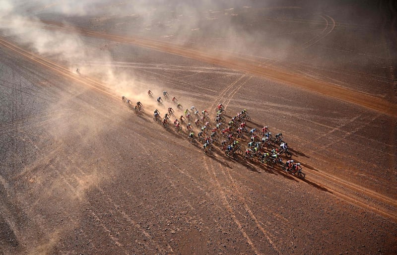 Competitors ride their bikes during Stage 4 of the 14th edition of Titan Desert 2019 mountain biking race between Merzouga and M’ssici, in Morocco.  AFP
