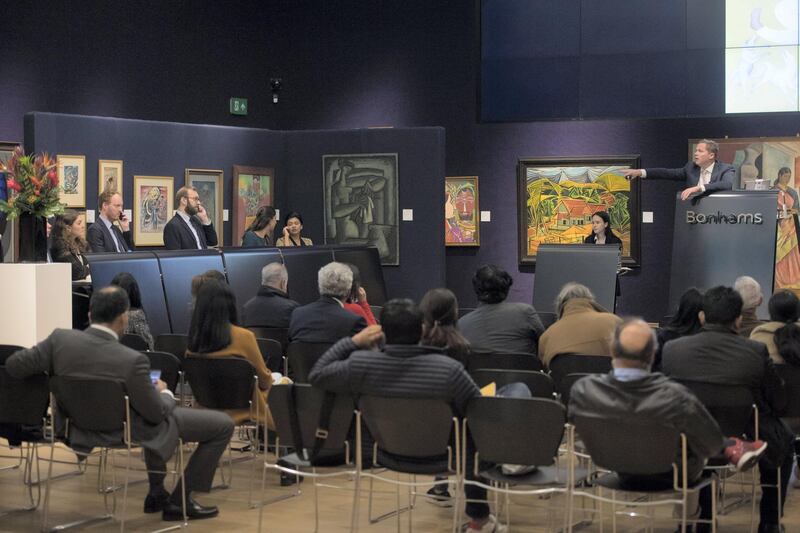 Image ��Licensed to i-Images Picture Agency. 24/10/2018. London, United Kingdom. 

Auctioneer Ralph Taylor (pictured) of Bonham's Auctioneers on New Bond Street, London, UK, sells works of art from the Abraaj collection, which include Manjit Bawa's oil on Canvas 'Untitled'  and Rashid Rana's 'Red Carpet'.



Picture by Ben Stevens / i-Images