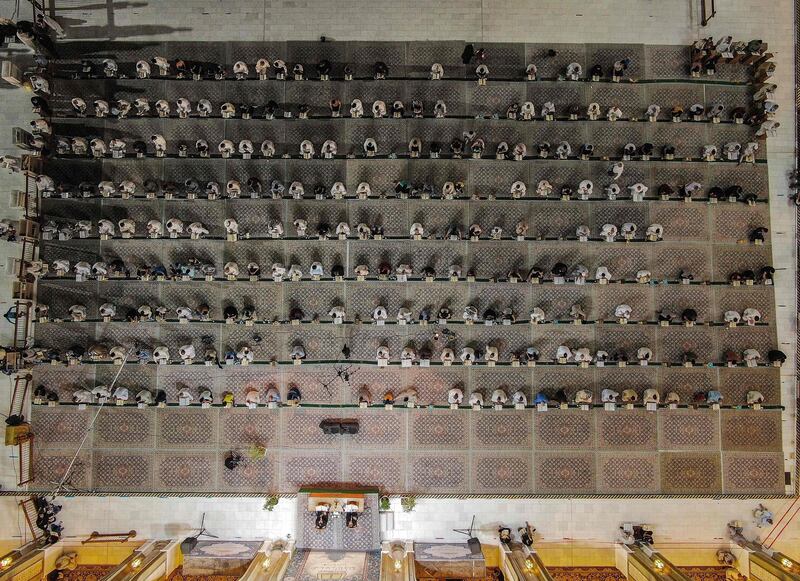 Worshippers recite the Quran at the Grand Mosque of Kufa near the central shrine city of Najaf, about 160 kilometres south of Iraq's capital Baghdad, during the month of Ramadan. AFP