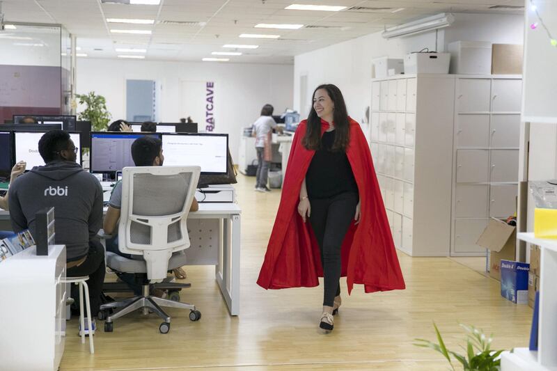 DUBAI, UNITED ARAB EMIRATES - DECEMBER 12, 2018. 

Lina Fahmy, Certified Research and Usability Analyst at Red Blue Blur Ideas (RBBi), wears her red cape.

RBBI does a number of things to keep its employees motivated and happy, including providing a free breakfast everyday, as well as a quarterly ceremony which awards the best two people of the business quarter with a Superman cape that they get to wear around the office. 

(Photo by Reem Mohammed/The National)

Reporter: GILLIAN DUNCAN
Section:  BZ