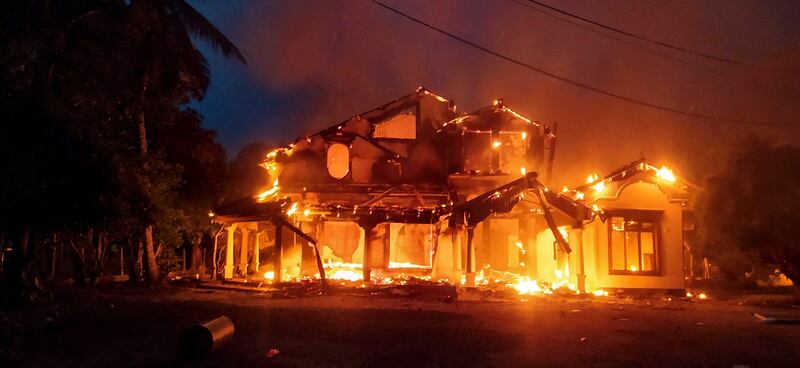 Anti-government demonstrators set fire to the house owned by Cabinet Minister Sanath Nishantha. Reuters