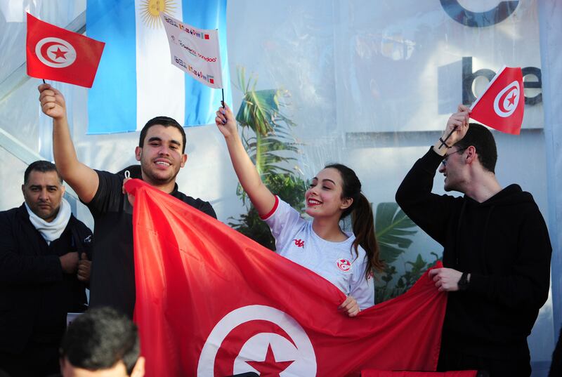 Tunisia soccer fans gather to watch their national team play against France in a World Cup Group D soccer match played in Qatar, on a large screen set up for fans in Tunis, Tunisia. AP Photo