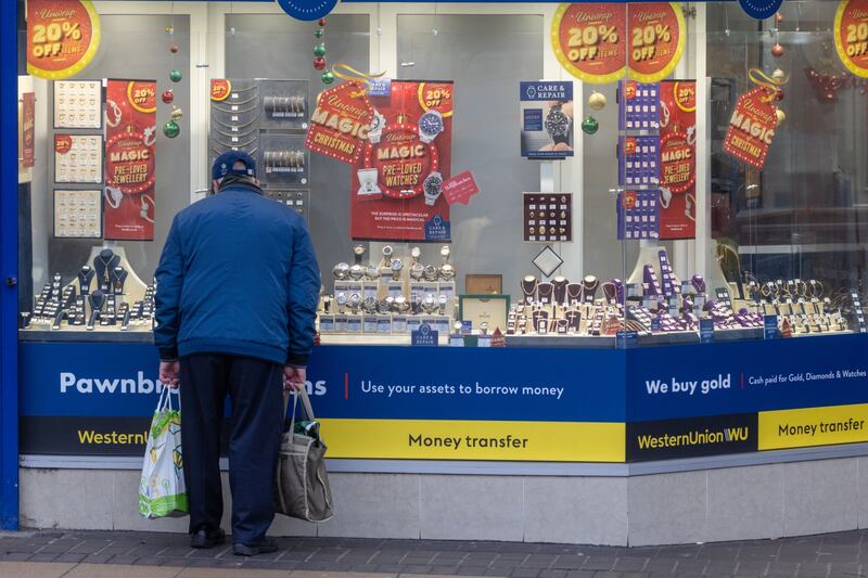 A shopper browses a pawnbroker's goods in Bexleyheath, London. Bloomberg