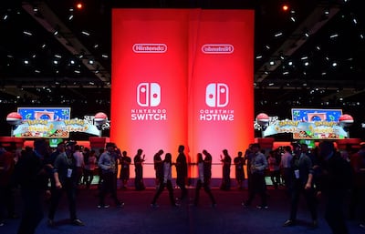 (FILES) In this file photo taken on June 12, 2018, people wait line to sample Nintendo Switch games at the 24th Electronic Expo, or E3 2018, in Los Angeles. Nintendo on June 15, 2021, unveiled updated versions of its hit console games including Zelda and Super Smash Brothers, but disappointed fans looking for a new model of its popular Switch console. / AFP / Frederic J. BROWN
