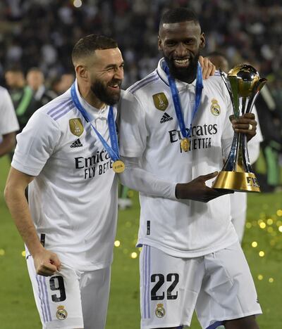 Karim Benzema (L) and Antonio Rudiger (R) of Real Madrid celebrate with the trophy. EPA.