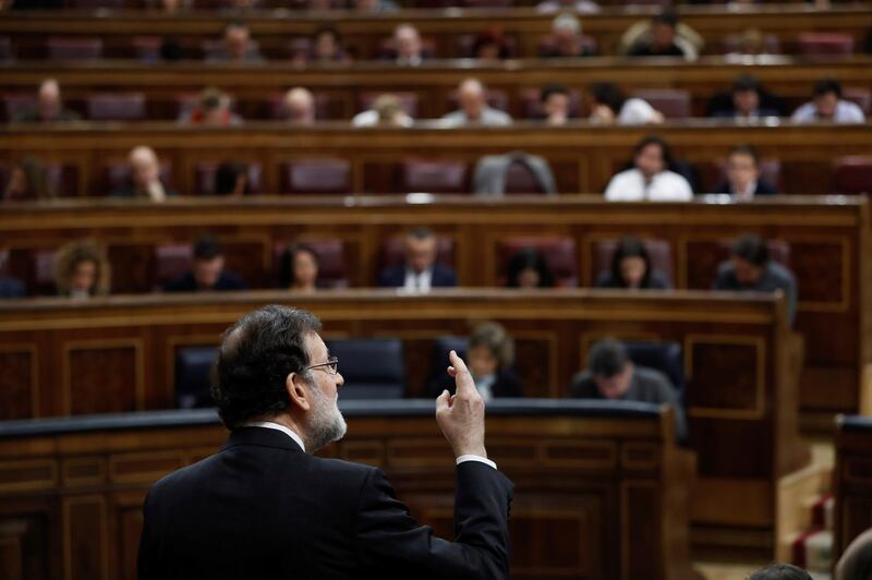 Spanish prime minister Mariano Rajoy delivers aspeech during the government's question time at the Spanish parliament's lower chamber in Madrid.  Ballesteros / EPA
