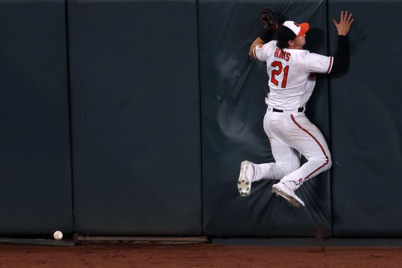 Baltirmore centerfielder Austin Hays misses the ball during a game against Miami Marlins in the seventh inning at Oriole Park at Camden Yards. AP Photo