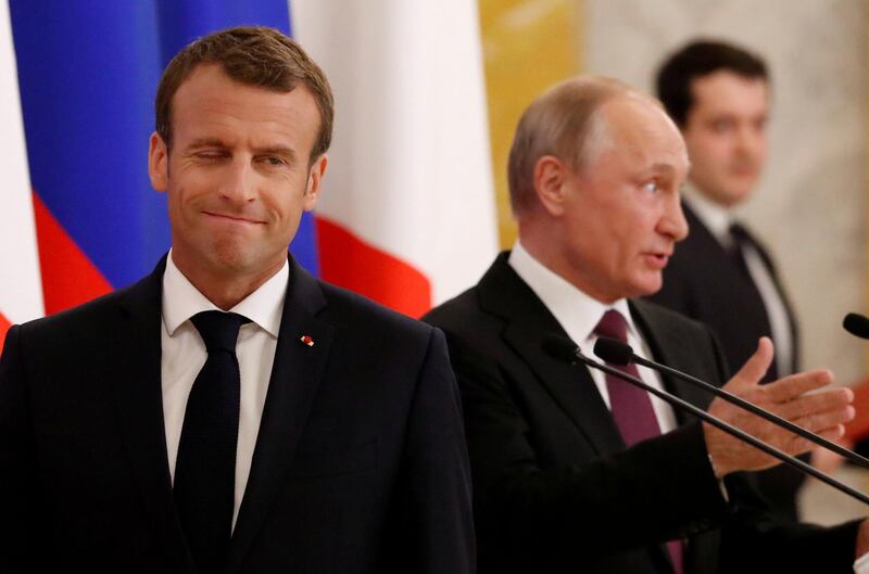 Russian President Vladimir Putin (R) and his French counterpart Emmanuel Macron attend a news briefing after the talks in St. Petersburg, Russia May 24, 2018. REUTERS/Grigory Dukor     TPX IMAGES OF THE DAY