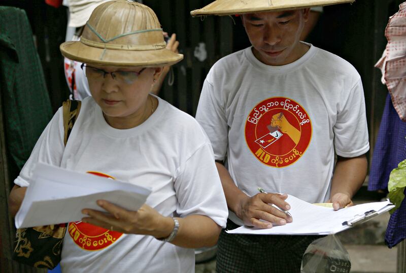 Member of the National League for Democracy (NLD) party wear T-shirts reading 'Vote NLD to change people's lives' during their campaign at Hlaing township in Yangon. Lynn Bo Bo / EPA