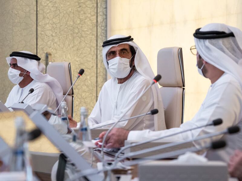 Sheikh Mohammed bin Rashid, Prime Minister and Ruler of Dubai, speaks to Mohammed Al Gergawi, Minister of Cabinet Affairs, during a UAE Cabinet meeting. Beside him is Sheikh Saif bin Zayed, Deputy Prime Minister and Minister of Interior. Courtesy: Sheikh Mohammed bin Rashid Twitter