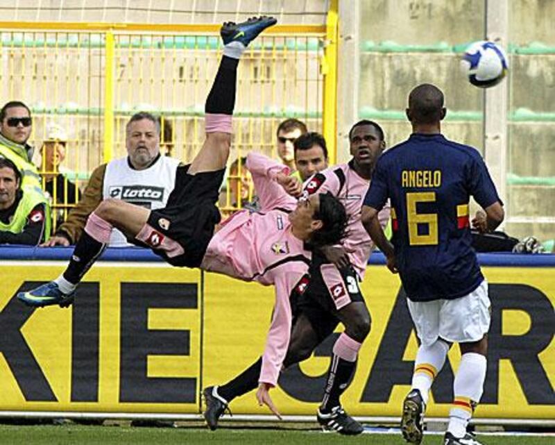 Palermo's Edison Cavani lets fly with an overhead kick in a Serie A game against Lecce.