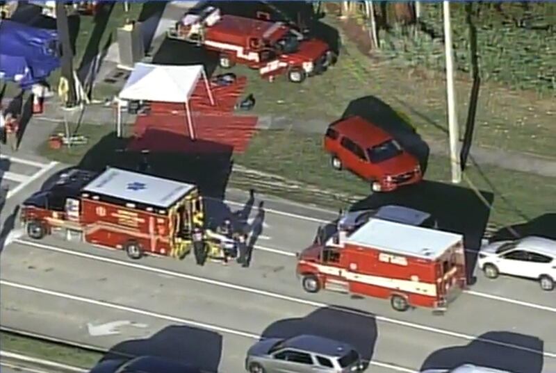 Rescue workers prepare to transport a victim on a stretcher near Marjory Stoneman Douglas High School following a shooting incident in Parkland, Florida, U.S. February 14, 2018 in this still image taken from a video. WSVN.com via REUTERS. ATTENTION EDITORS - THIS IMAGES HAS BEEN PROVIDED BY A THIRD PARTY. NO RESALES, NO ARCHIVES. MANDATORY CREDIT. NO ACCESS SOUTHEAST FLORIDA MEDIA.