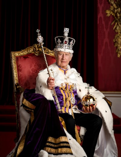 King Charles III in full regalia in the Throne Room at Buckingham Palace. PA