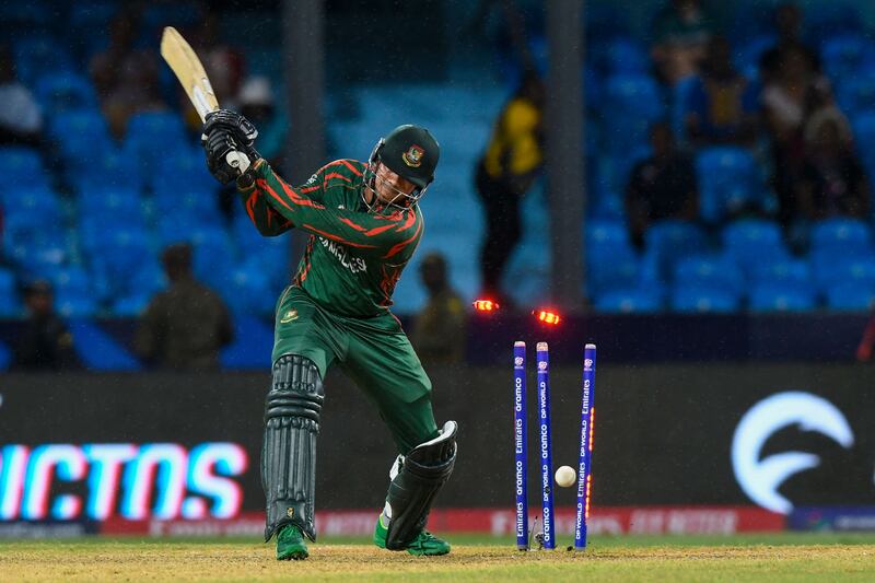 Bangladesh vice-captain Taskin Ahmed is bowled by Afghanistan's Naveen-ul-Haq. AFP