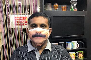 Binesh G Paul from Etumanoor in southern state of Kerala, is using digital printing to customise protective masks for customers by printing their faces on the protective cloth to make it look like real. Photo credit: Binesh G Paul