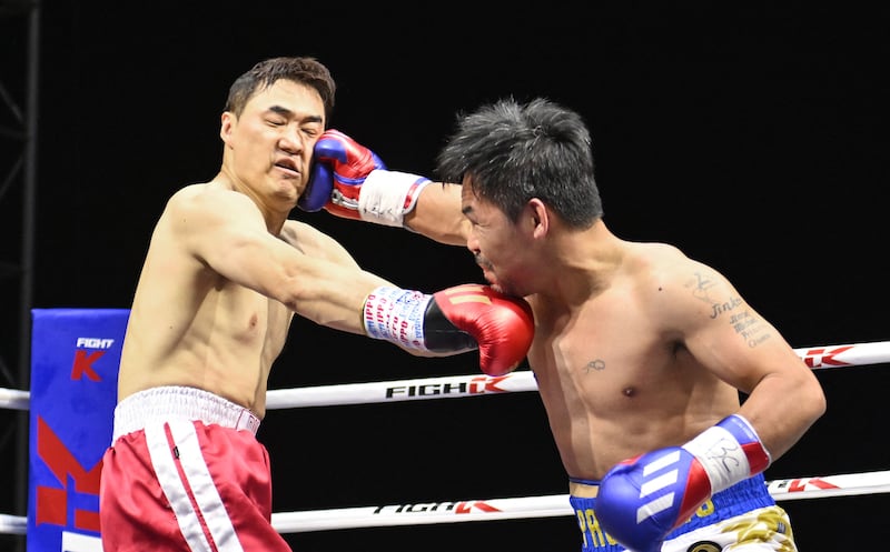 Manny Pacquiao lands a right hook on DK Yoo during their exhibition bout. AFP