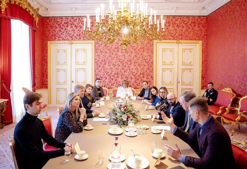 Ukraine's ambassador to the Netherlands, Maksym Kononenko, third right, and his wife Tetiana Doroshenko, fourth left, attend a meeting of members of the Ukrainian community with Dutch King Willem-Alexander, third left, and Queen Maxima, second left, to discuss the situation in Ukraine, in The Hague. EPA